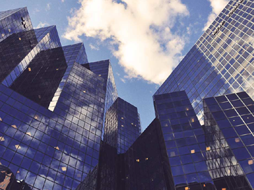 Modern city buildings represents the Celonis Process Mining